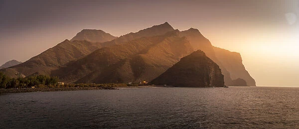 View of coastline and mountains in background during golden hour, Puerto de La Aldea, Gran Canaria, Canary Islands, Spain, Atlantic, Europe