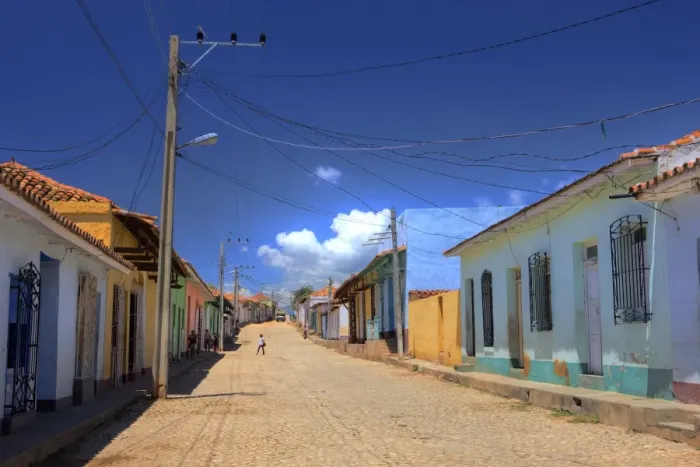 Framed Print : View along cobbled street lined with bright-painted houses, Trinidad, Cuba Framed Print : View along cobbled street lined with bright-painted houses, Trinidad, Cuba