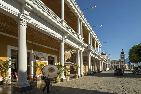 View along colonnades of Plaza de la Independencia to Granada Cathedral in the heart of this historic city, Granada, Nicaragua, Central America