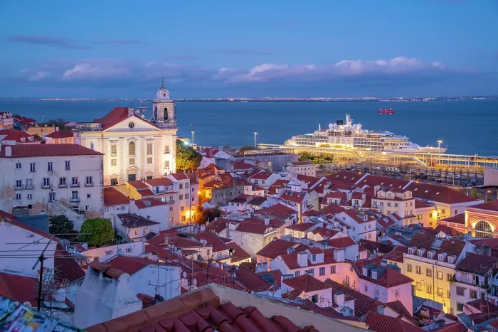 Framed Print : View of colourful buildings and red rooftops at dusk in the Alfama District, Lisbon, Portugal, Europe