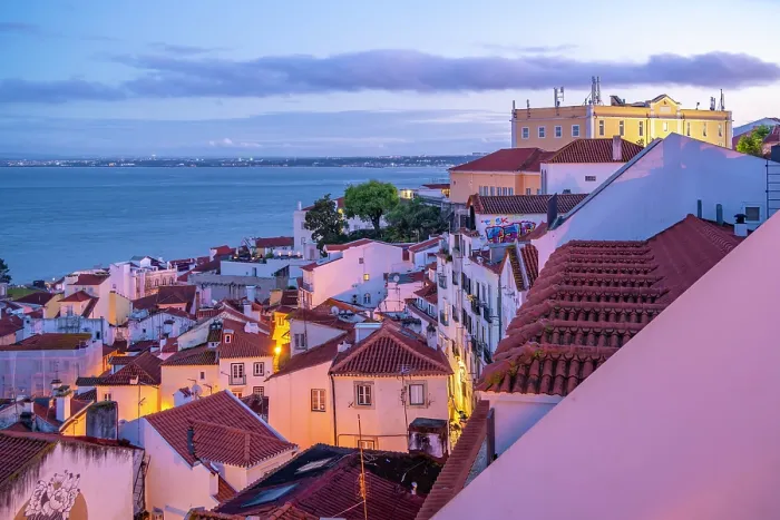Framed Print : View of colourful buildings and red rooftops at dusk in the Alfama District, Lisbon, Portugal, Europe