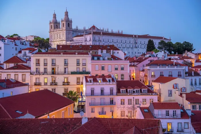 Framed Print : View of colourful buildings and red rooftops at dusk in the Alfama District, Lisbon, Portugal, Europe