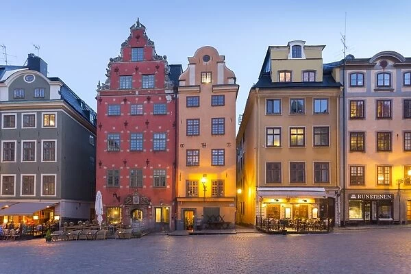 View of colourful buildings on Stortorget, Old Town Square in Gamla Stan at dusk