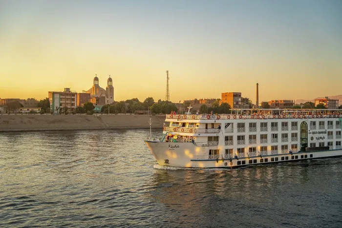 Framed Print : View of cruise boats from cruise boat near Esna on the Nile River at sunset, Esna, Egypt, Africa Framed Print : View of cruise boats from cruise boat near Esna on the Nile River at sunset, Esna, Egypt, Africa