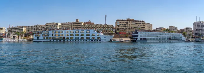 Framed Print : View of cruise boats on the Nile river from small boat in Aswan, Aswan, Nubia, Egypt, North Africa, Africa Framed Print : View of cruise boats on the Nile river from small boat in Aswan, Aswan, Nubia, Egypt, North Africa, Africa