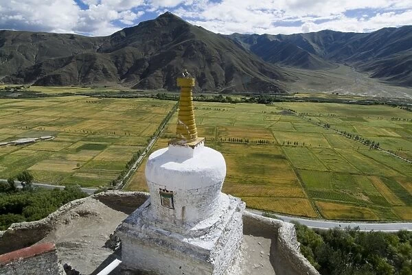 View over cultivated fields, Yumbulagung Castle, restored version of the regions oldest building, Tibet