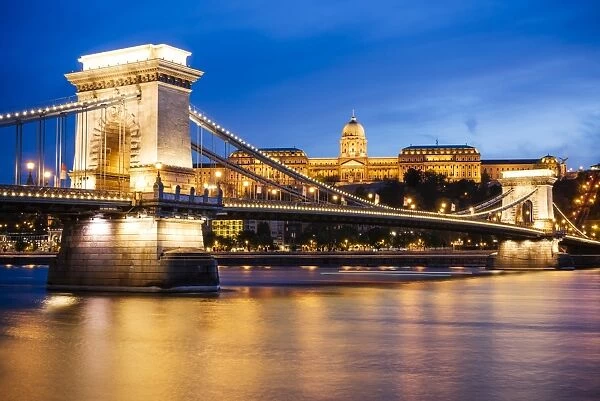 View across Danube River of Chain Bridge and Buda Castle at night, UNESCO World Heritage Site