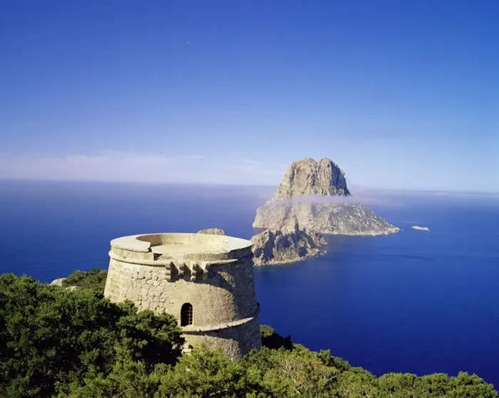 Framed Print : View of defence tower and the rocky island of Es Vedra Framed Print : View of defence tower and the rocky island of Es Vedra