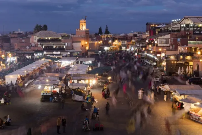 Framed Print : View over the Djemaa el Fna at dusk showing food stalls and crowds of people, Marrakech