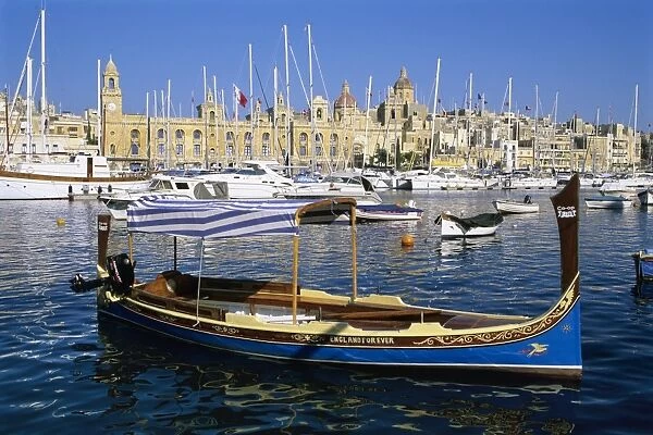 View across Dockyard Creek to Maritime Museum on Vittoriosa with traditional boat