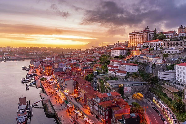 View of Douro River and The Ribeira district from Dom Luis I bridge at sunset, UNESCO World Heritage Site, Porto, Norte, Portugal, Europe