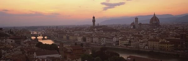 View at dusk over rooftops of Florence, showing Duomo, Uffizi and Ponte Vecchio from Pizalle Michelangelo, Florence, Tuscany