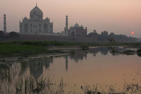 View at dusk across the Yamuna river of the Taj Mahal