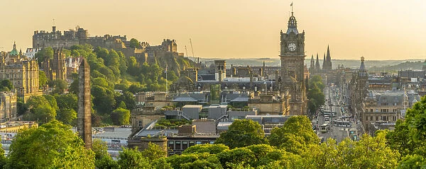 View of Edinburgh Castle, Balmoral Hotel and Princes Street from Calton Hill at golden