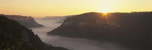 View from Eichfelsen Rock on Schloss Werenwag Castle and Danube Valley at sunrise, Upper Danube Nature Park, Swabian Alb, Baden Wurttemberg, Germany, Europe