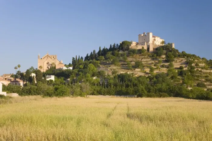 Framed Print : View across fields to the parish church and hilltop Sanctuary of Sant Salvador Framed Print : View across fields to the parish church and hilltop Sanctuary of Sant Salvador