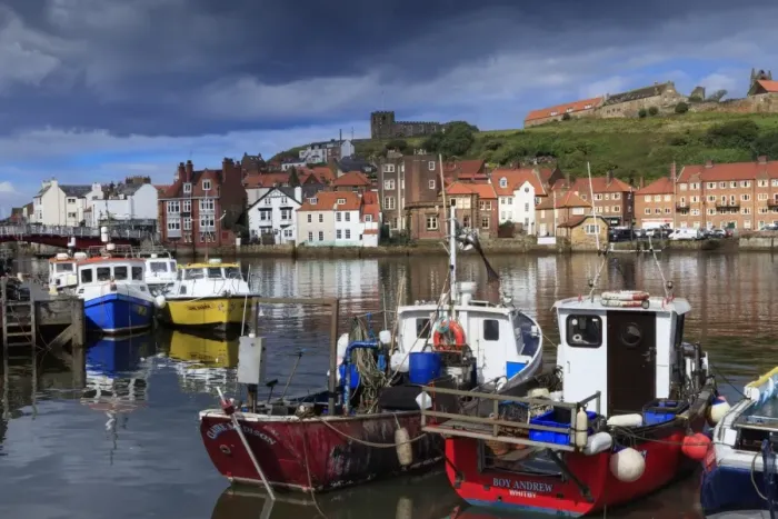 Framed Print : View of fishing boats in the harbour and the town centre, Whitby, Yorkshire, England Framed Print : View of fishing boats in the harbour and the town centre, Whitby, Yorkshire, England