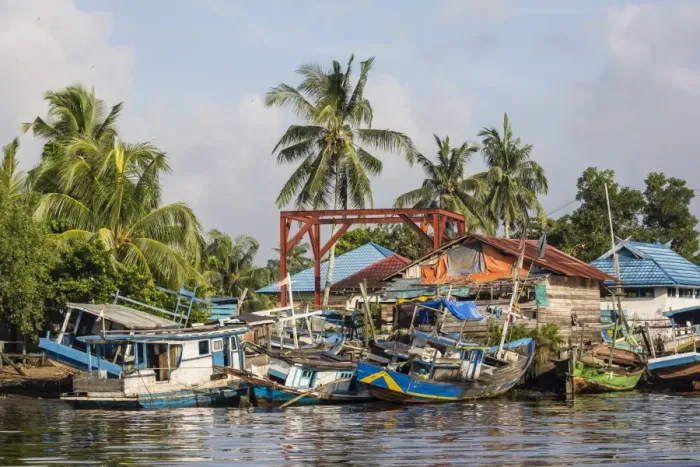 Framed Print : View of fishing boats on the Kumai River, Central Kalimantan province, Borneo, Indonesia Framed Print : View of fishing boats on the Kumai River, Central Kalimantan province, Borneo, Indonesia