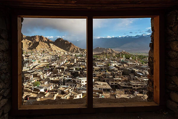 View through the frame of a window onto the skyline of Leh, Ladakh, Himalayas, northern India, Asia