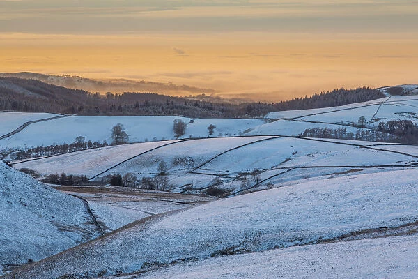 View of frozen landscape near Macclesfield at sunset, High Peak, Cheshire, England