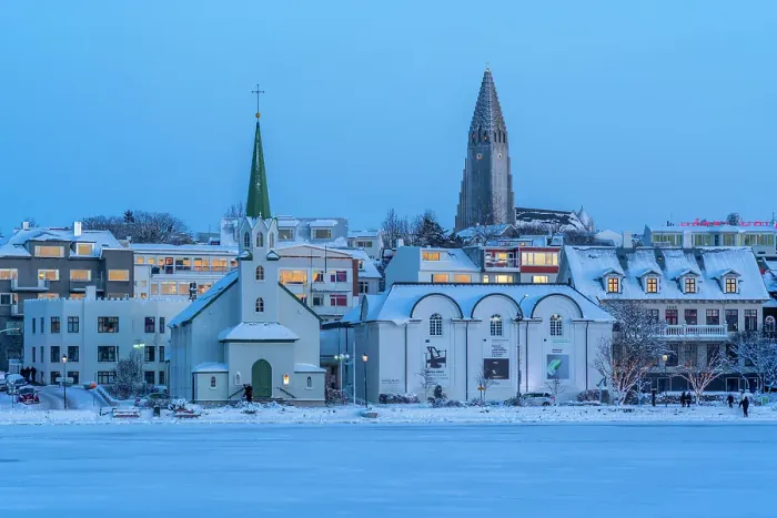 Framed Print : View of the Hallgrimskirkja Church and city skyline of Reykjavik from Tjornin lake at sunset in winter, Reykjavik, Iceland