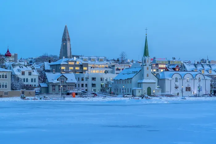 Framed Print : View of the Hallgrimskirkja Church and city skyline of Reykjavik from Tjornin lake at sunset in winter, Reykjavik, Iceland