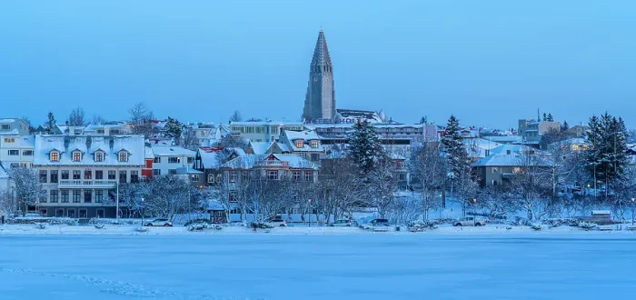 Framed Print : View of the Hallgrimskirkja Church and city skyline of Reykjavik from Tjornin lake at sunset in winter, Reykjavik, Iceland