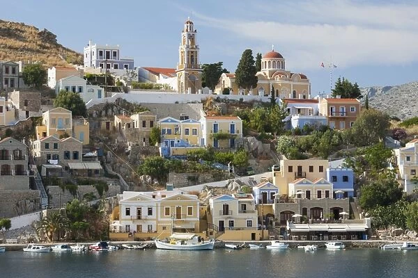 View over harbour to colourful houses and church, Gialos (Yialos), Symi (Simi), Rhodes