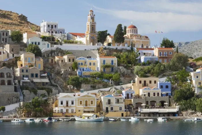 Framed Print : View over harbour to colourful houses and church, Gialos (Yialos), Symi (Simi), Rhodes Framed Print : View over harbour to colourful houses and church, Gialos (Yialos), Symi (Simi), Rhodes