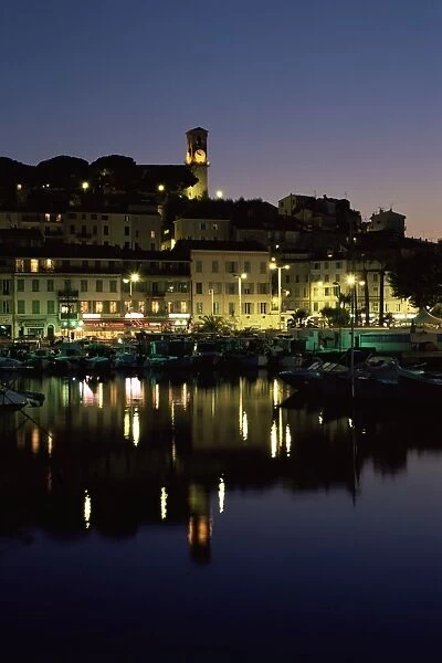 View across harbour to the old quarter of Le Suquet, at night, Cannes, Alpes-Maritimes