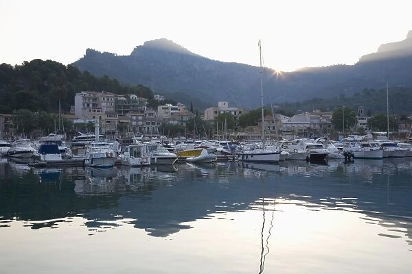 View across the harbour at sunrise, Port de Soller, Mallorca, Balearic Islands