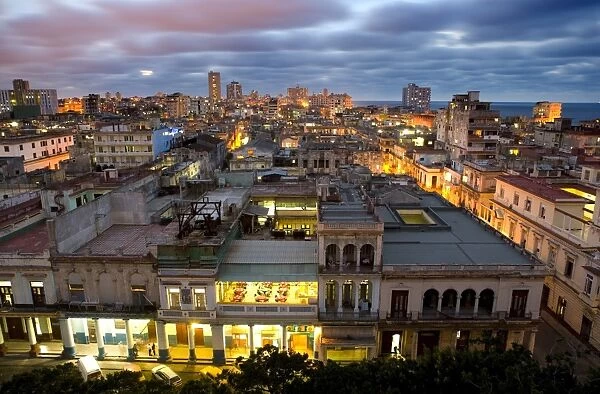 View over Havana Centro at night from 7th floor of Hotel Seville showing contrast of old