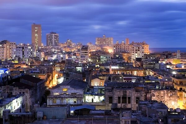 View over Havana Centro at night from Hotel Seville showing contrast of old