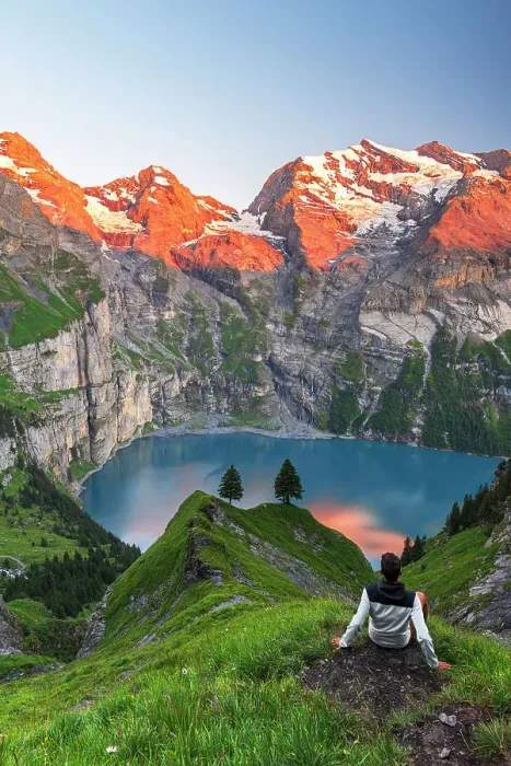 Framed Print : View of a hiker resting in front of the Oeschinensee lake surrounded by snowy peak at sunset, Oeschinensee, Kandersteg, Bern Canton, Switzerland, Europe Framed Print : View of a hiker resting in front of the Oeschinensee lake surrounded by snowy peak at sunset, Oeschinensee, Kandersteg, Bern Canton, Switzerland, Europe