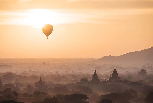 View of hot air balloon and temples at dawn, Bagan (Pagan), Mandalay Region, Myanmar (Burma)