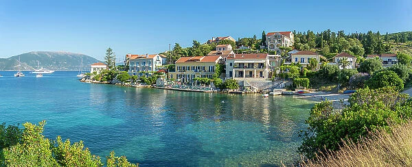 View of hotels overlooking Fiscardo harbour, Fiscardo, Kefalonia, Ionian Islands, Greek Islands, Greece, Europe
