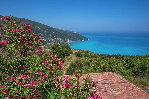 View of houses overlooking coastline, sea and hills near Agkonas, Kefalonia, Ionian Islands, Greek Islands, Greece, Europe