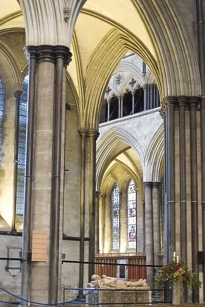 A view of the interior of Salisbury Cathedral with a tomb and effigy of an ancient knight