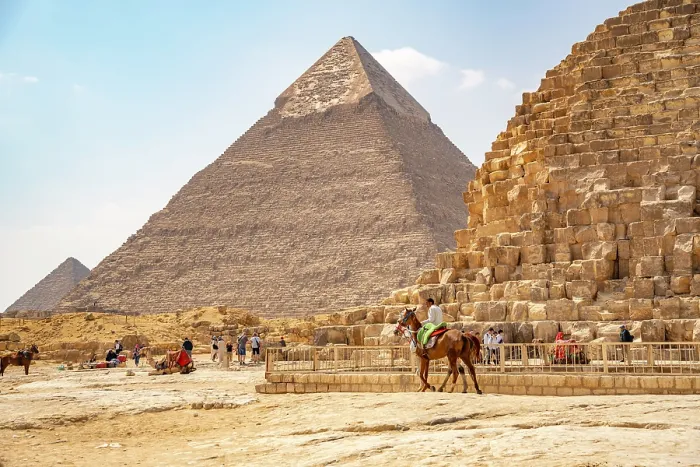 Framed Print : View of the Khafre Pyramid of Giza and a man on horseback on a sunny day, Giza, Cairo, Egypt, Africa Framed Print : View of the Khafre Pyramid of Giza and a man on horseback on a sunny day, Giza, Cairo, Egypt, Africa