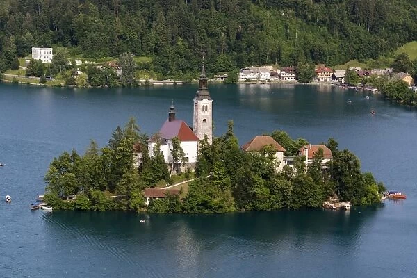 A view from above of Lake Bled and the Assumption of Mary Pilgrimage Church, Slovenia