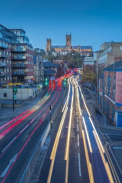 View of Lincoln Cathedral and traffic on Broadgate at dusk, Lincoln, Lincolnshire