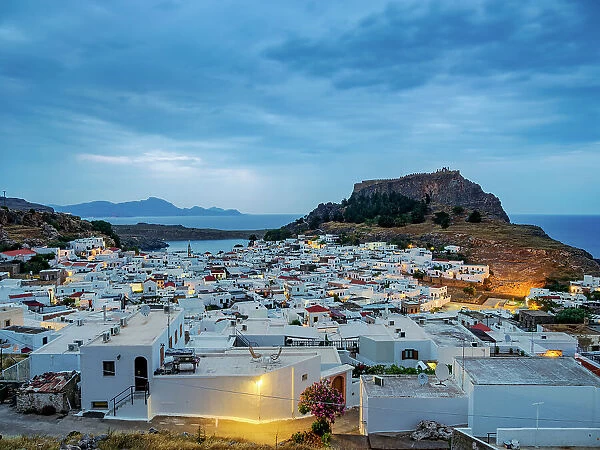 View over Lindos village towards the Acropolis at dawn, Rhodes Island, Dodecanese, Greek Islands, Greece, Europe