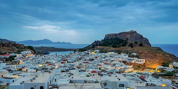 View over Lindos village towards the Acropolis at dawn, Rhodes Island, Dodecanese, Greek Islands, Greece, Europe