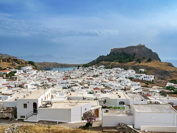 View over Lindos village towards the Acropolis, Rhodes Island, Dodecanese, Greek Islands, Greece, Europe