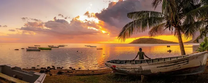Framed Print : View of local man sat on boat viewing Le Morne from Le Morne Brabant at sunset, Savanne District, Mauritius, Indian Ocean, Africa Framed Print : View of local man sat on boat viewing Le Morne from Le Morne Brabant at sunset, Savanne District, Mauritius, Indian Ocean, Africa