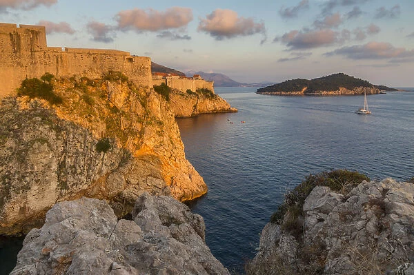 View to Lovrijenac Fortress (St. Lawrence Fortress), the city walls and Lokrum Island at sunset