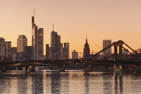 View over Main River to Floesserbruecke bridge and financial district, Frankfurt