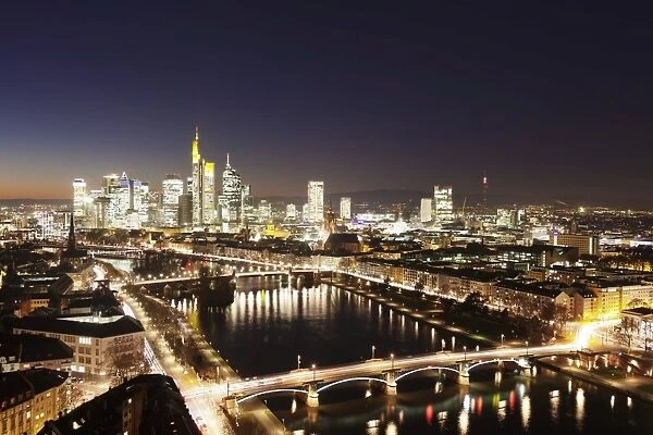 View over Main River to Ignatz Bubis Bridge financial district skyline, Frankfurt