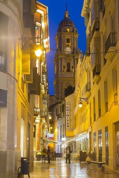 View of Malaga Cathedral from Calle Marques de Larios at dusk, Malaga, Costa del Sol
