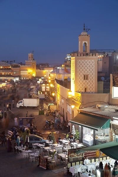 View over market square at dusk, Place Jemaa El Fna, Marrakesh, Morocco, North Africa, Africa